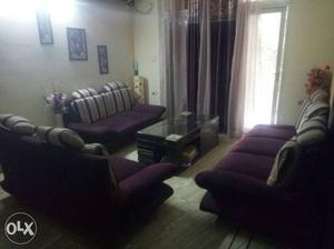 Purple coloured sofa..