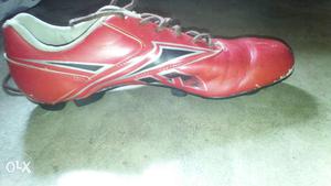 Unpaired Red Soccer Cleats