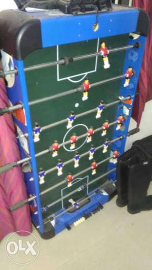 Blue, Green And White Foosball Table