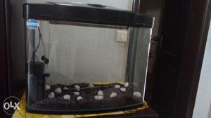 Chinese aquarium with filter, pump and gravel.