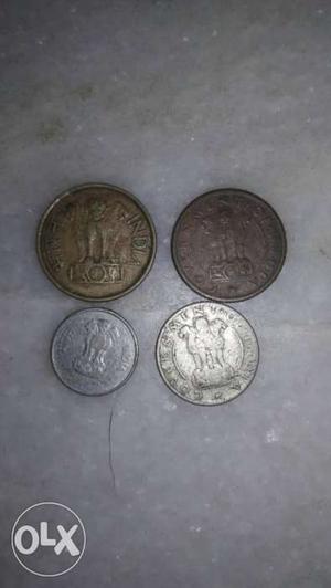 Four Round Silver And Gold Coins