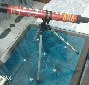 Red And Black Telescope With Stand