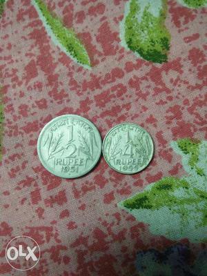 Two 1/2 And 1/4 Round Coins