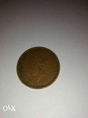 Beige George VI King Emperor Coin