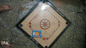 Brand new carrom, unused, 26", with striker and coins