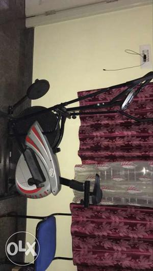 Silver, Red And Black Stationary Bicycle