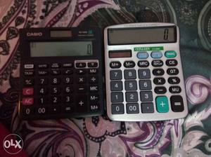 Two Black And Gray Digital Calculators