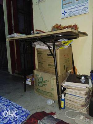 Wooden table with iron stand