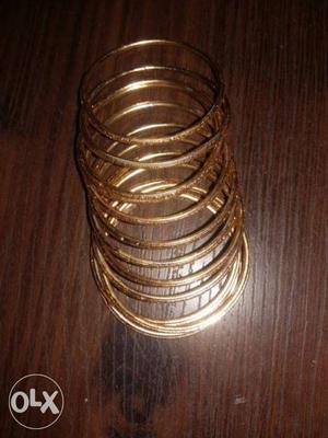 12 metal bangles (gold colour) for baby girl