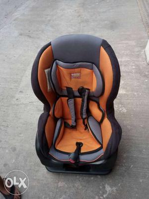 Baby's Orange And Gray Car Seat