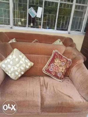 Brown Fabric Loveseat With Two Throw Pillows