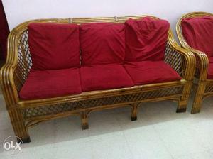 Brown Ratan Bench With Red Cushion