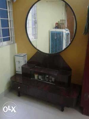 Brown Wooden Cabinet With Round Frame Mirror