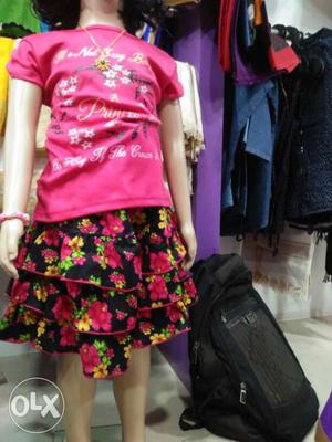 Girl's Pink T Shirt And Black Floral Skirt