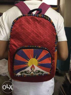 Red, Orange And Purple Backpack