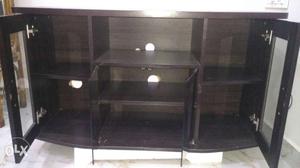 TV stand with sufficient storage and show case.