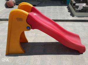 Yellow And Red Plastic Slide.