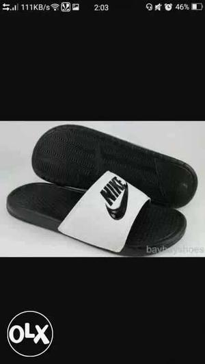 Brand new Pair Of White-and-black Nike Sliders