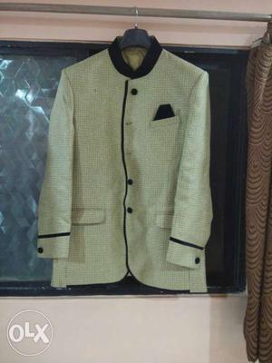 One time used Golden color jodhpuri suit.
