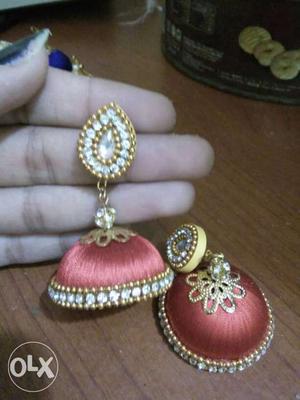 Pair Of Diamond Embellished And Red Jhumka Earrings