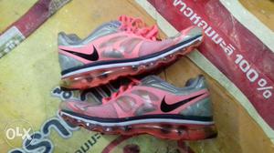 Pair Of Pink-and-gray Nike Low Top Sneakers