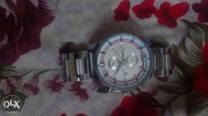 Round Silver, White, And Red Chronograph Watch