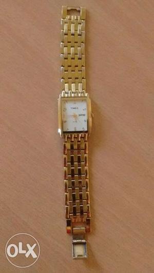 Timex gents watch with date and time. Golden