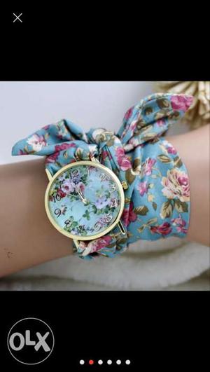 Trendy round dial quartz watches with floral cloth bands..