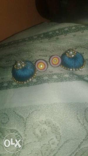 Two Pairs Of Blue And Purple Jhumka Earrings
