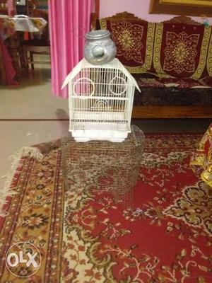 Two White And Gray Metal Bird Cages