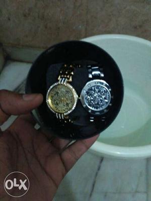 Two watches gold nd silver branded watch With