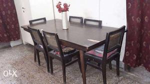 6 seater wooden dining table with chairs in good