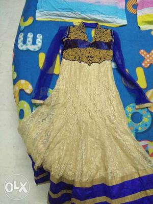 Blue and golden suit in very good condition.