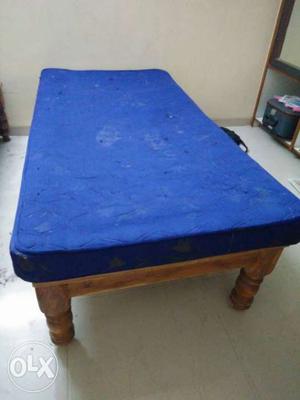 Brown Wooden Bed Frame; Blue Bed Mattress