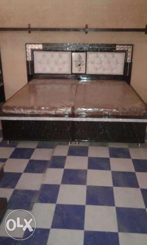 Brown Wooden Bed Frame With Two Brown Mattresses