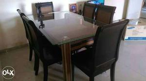 Dining Table (wooden) with 6 chairs. 5yrs old. In good