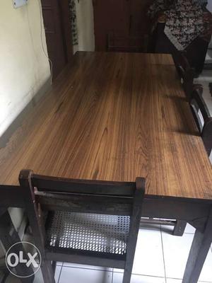 Excellent condition dinning table with 5-6 chairs.