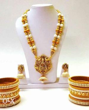 Gold Necklace, Bracelet, And Pair Of Earrings