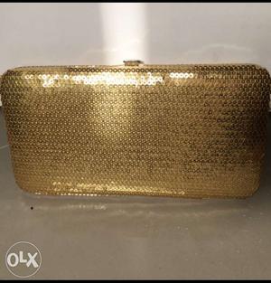 Gold sequinned wallet.