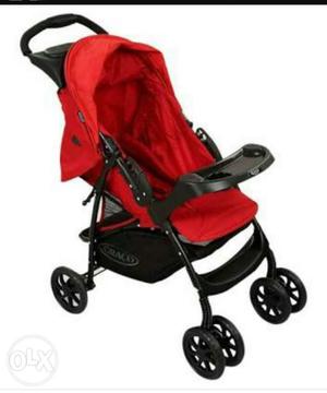 Graco pram red and black color.