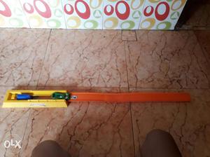 Orange And Yellow Plastic Measuring Tool