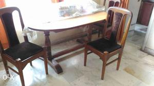 Oval Brown Wooden Dining Table With Three Chairs Set