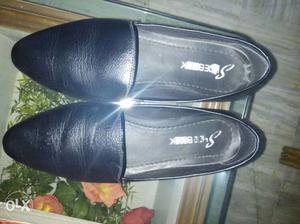 Pair Of Black Leather Flats
