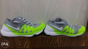 Pair Of Gray-and-green Nike Running Shoes