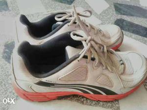 Pair Of White-and-black Puma Running Shoes
