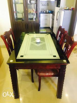 Rectangular Black And Brown Dining Table And Three Chair