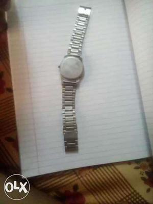 Reebok wrist watch with metal chain strap.