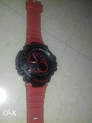Round Black And Red Chronograph Watch