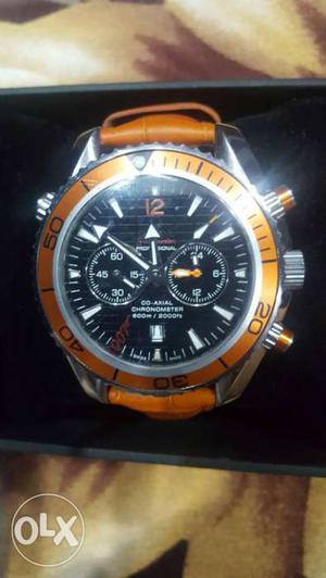 Round Silver And Orange Chronograph Watch In Box