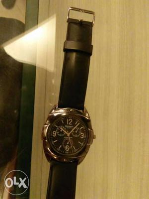 Round Silver Chronograph Watch With Black Leather Band